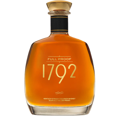 1792 Full Proof bourbon bottle displayed on a wooden table, surrounded by glasses filled with amber-colored whiskey, highlighting its rich and bold character.