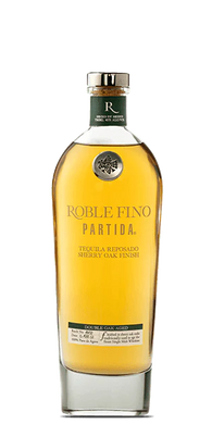 Discover the elegance of Tequila Partida Roble Fino Reposado. Double-aged in American bourbon & French oak barrels, this refined tequila offers rich, smooth flavors you’ll savor.  