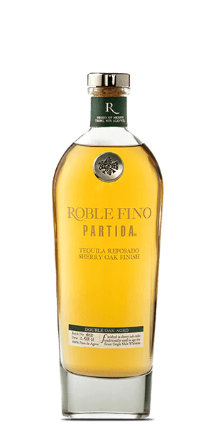 Discover the elegance of Tequila Partida Roble Fino Reposado. Double-aged in American bourbon & French oak barrels, this refined tequila offers rich, smooth flavors you’ll savor.  