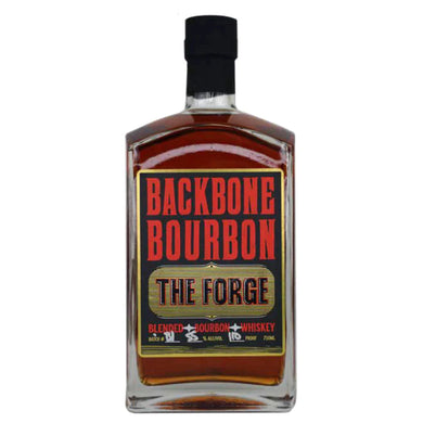 Backbone Bourbon The Forge bottle on a rustic wooden surface, surrounded by warm lighting that highlights its amber liquid and bold label design.