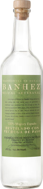 Banhez Mezcal Pechuga bottle, featuring a sleek label design with an illustration of a rooster and traditional typography, placed on a rustic wooden surface with warm lighting.